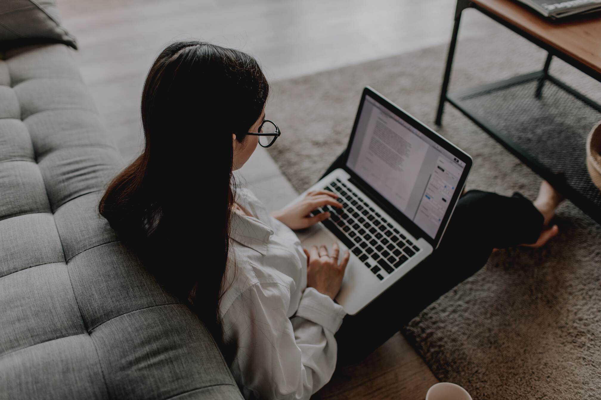 Woman Working At Home Using Her Laptop